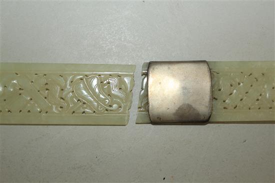 A Chinese pale celadon jade belt buckle section and a similar page turner, late 19th century, 28.5cm, broken with an old silver repair